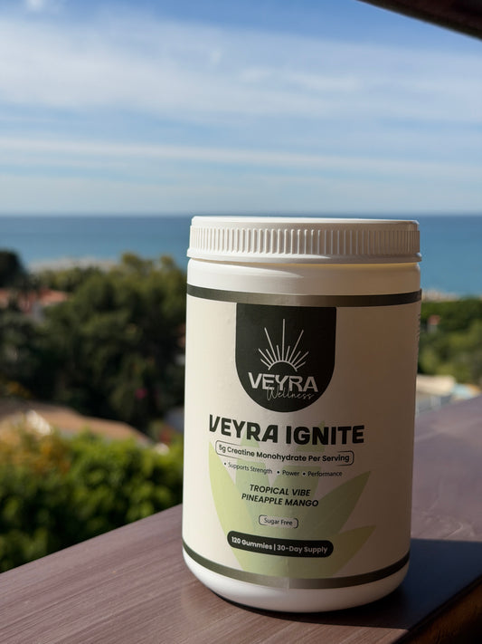 Veyra Ignite supplement container on a table with a scenic background